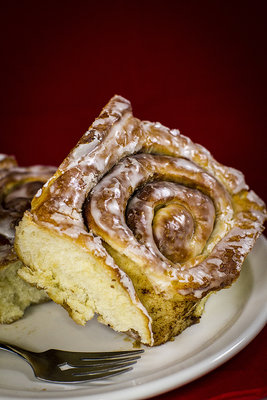 Probably my favorite shots of the entire series. The cinnamon bun were take with a red backdrop, plate and fork for added effect. They were taken with a 50mm lens at F1.2. The lighting consists of two LED softboxes and a ring light on the lens. The white balance is set warmer for added effect. I am getting hungry just looking at them...