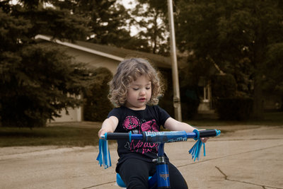 Nice capture Sabrina... I like how your subject was caught &quot;in the moment&quot; and the touch of colour helps her stand out from the background.