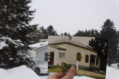 An old photograph is held up to show the house her grandma grew up in. Maddy then went to Quebec and matched up the house and the photo to create a wonderful effect.